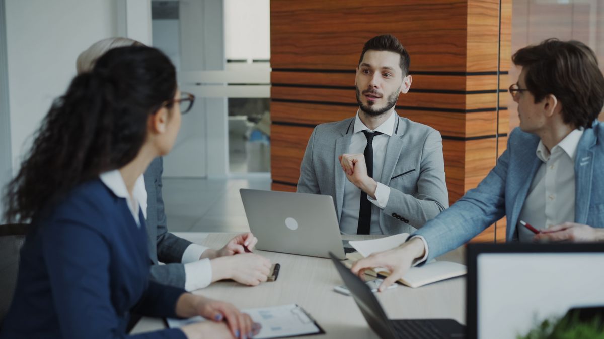 Business team meeting to review multi-location performance and marketing strategy