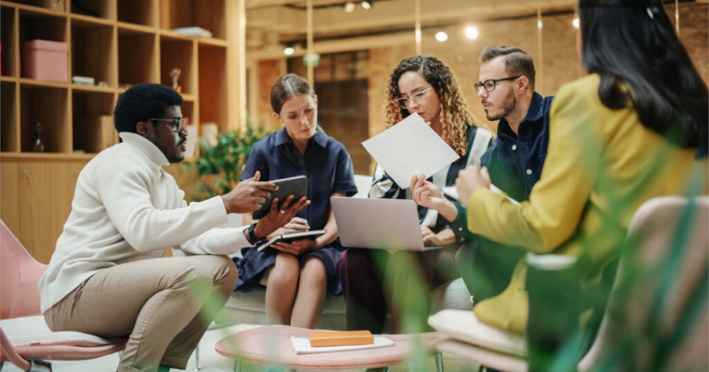 B2B buying committee with multiple stakeholders including executives, procurement, technical evaluators, and end users each influencing the purchase decision